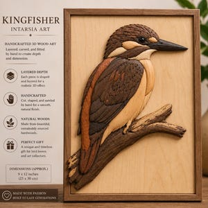 May include: A rectangular wooden wall art piece featuring an intarsia kingfisher bird perched on a branch. The bird is composed of layered, carved wood in shades of brown, tan, and cream. The artwork is framed in wood and measures 9 x 12 inches.