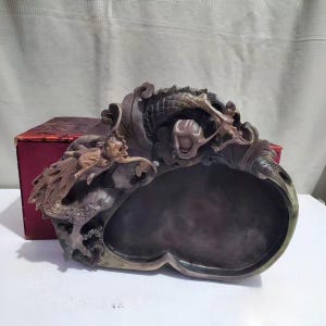 May include: A set of three ceramic nesting bowls in graduating sizes. The bowls are white with a speckled, textured finish and feature a slightly flared rim. The largest bowl measures approximately 8 inches in diameter.