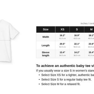 May include: A white t-shirt size chart featuring a line drawing of a t-shirt with labeled width, length, and sleeve length. A table displays measurements in inches and centimeters for sizes XS through XL. The text includes 'SIZE CHART' and 'kindness.'