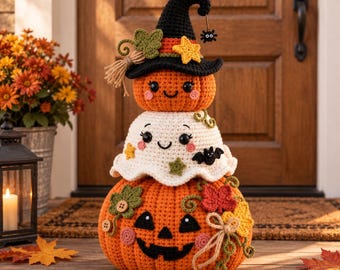 May include: A stacked crochet Halloween decoration featuring a large orange jack-o'-lantern base, a white ghost middle layer, and a small orange pumpkin top wearing a black witch hat with a yellow star, green leaves, and a dangling spider charm.
