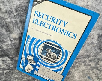 Electrónica de seguridad, 2.ª edición, 1977. Libro de John Cunningham y Howard W. Sams, Azul y Blanco.