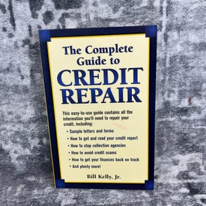 May include: A book titled "The Complete Guide to Credit Repair" with a yellow and blue cover. The cover text includes information on credit repair, sample letters, credit reports, and avoiding scams. The author is Bill Kelly, Jr.