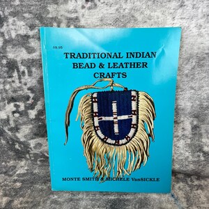 May include: A turquoise book cover with the title "TRADITIONAL INDIAN BEAD & LEATHER CRAFTS" and an illustration of a beaded and fringed pouch. The book is by Monte Smith & Michele VanSickle.