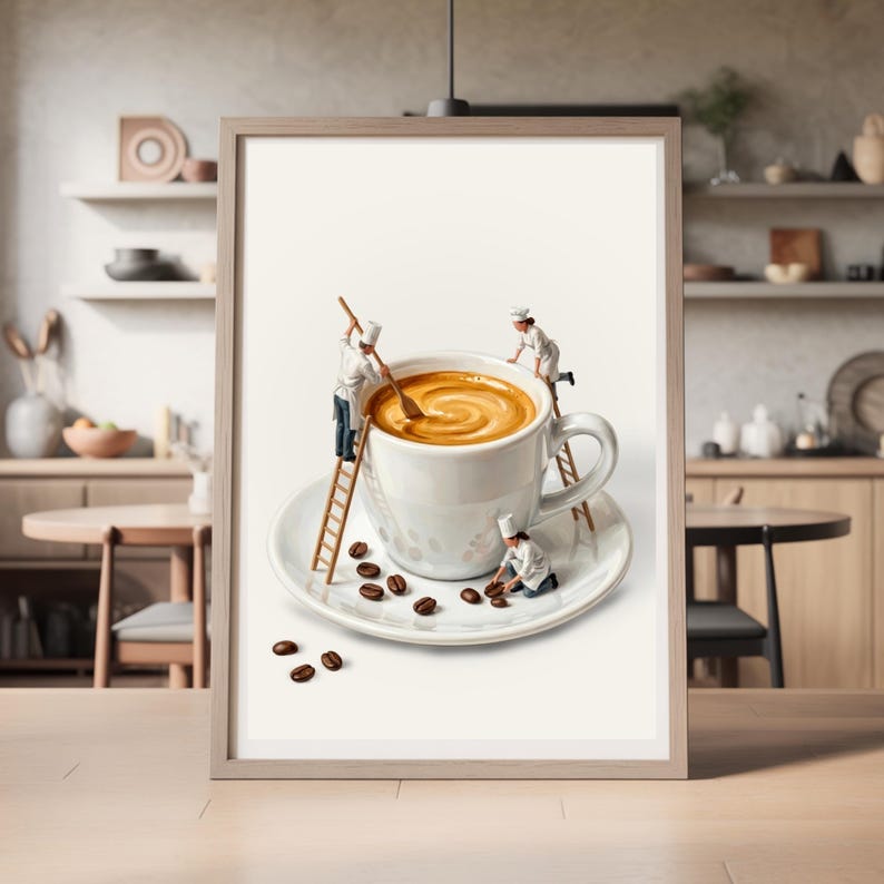 May include: Framed art print featuring a whimsical scene of miniature chefs working on a giant coffee cup. The cup sits on a saucer with scattered coffee beans. The chefs are stirring the coffee and arranging the beans.