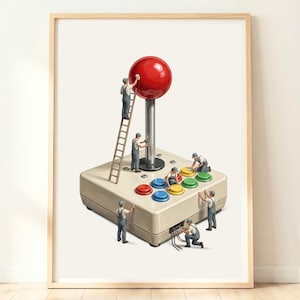 May include: A framed art print depicting miniature workers cleaning a large vintage arcade joystick controller. The controller features a glossy red ball top, a silver shaft, and six colourful buttons in red, blue, yellow, and green on a beige base.