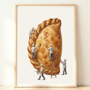 May include: A framed art print depicts a giant, golden-brown pastry being worked on by miniature bakers. They are applying a glaze with brushes and using tools. The pastry has a braided edge and a textured surface, set against a white background.