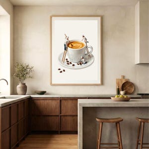 May include: A framed wall art print featuring a white ceramic coffee cup on a matching saucer. Three miniature figures in white chef uniforms are depicted interacting with the cup, using wooden ladders to stir the coffee and arrange beans.