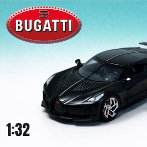 May include: A black Bugatti toy car with the Bugatti logo in a red oval. The car is a 1:32 scale model with silver wheels and a rear spoiler. The Tiny Wheels Club logo is also visible.