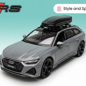 May include: A grey Audi RS6 model car with a black roof box. The car has black wheels and the text "Audi RS6" on the front. The image also includes the text "Style and Speed".