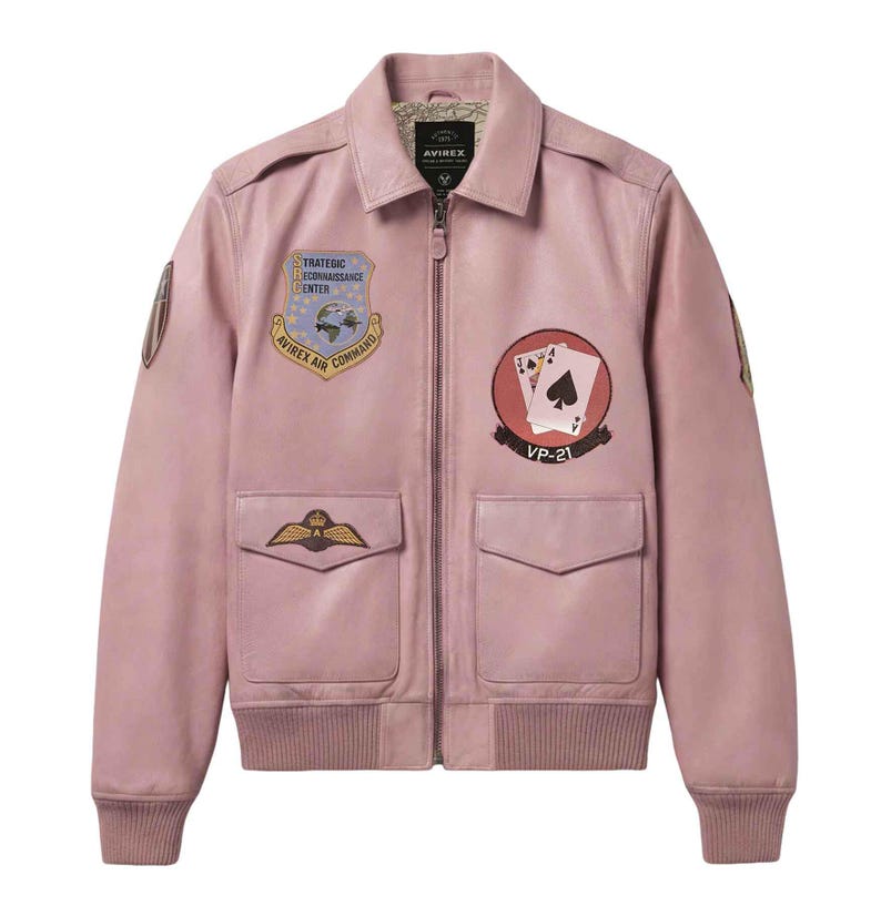 May include: A pink leather bomber jacket with multiple patches. The jacket features a collared neckline, a zipper closure, and two front pockets. Patches include the text "Strategic Reconnaissance Center" and "Avirex Air Command".