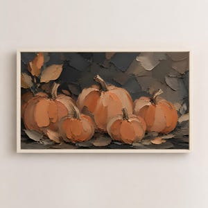 May include: A rectangular wall art piece featuring an oil painting of five orange pumpkins of varying sizes. The pumpkins are rendered with thick, visible brushstrokes against a dark, textured background of charcoal and muted brown tones.