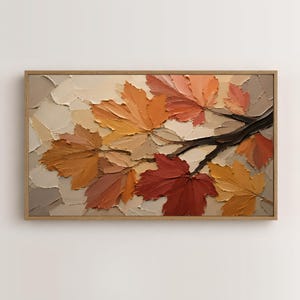 May include: A rectangular wall art piece featuring a thick impasto oil painting of autumn maple leaves on a branch. The textured leaves are rendered in shades of deep red, burnt orange, golden yellow, and beige, set against a neutral background.