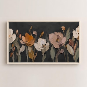 May include: A rectangular framed wall art piece featuring a thick impasto oil painting of flowers in shades of white, beige, ochre, and muted green against a dark charcoal gray background. The textured floral arrangement spans the horizontal canvas.