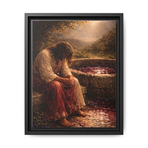 May include: A framed canvas print depicts a person in a white and red robe, seated near a stone well. The artwork features a serene landscape with a soft, natural color palette, and a beam of light shining from above.