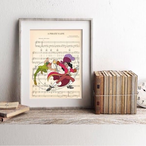 May include: Framed print featuring a vintage sheet music background with a colorful illustration of Captain Hook and Peter Pan. The print is displayed on a rustic wooden shelf with books and a clock.