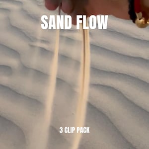 May include: Image of sand flowing through the air, with the words "SAND FLOW" and "3 CLIP PACK" in white text. The sand is a light beige color, and the background is a textured, wavy pattern.