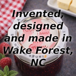 A top-down view of a Jar Genie on a preserves jar with text overlay: "Invented, designed and made in Wake Forest, NC."
