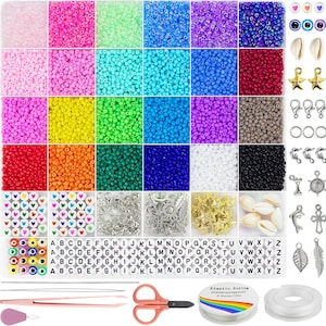 May include: A crafting kit with a variety of colorful beads, charms, and accessories. Includes round beads in various colors, letter beads, star and shell charms, clasps, scissors, elastic string, and tools for jewelry making.