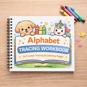 May include: A spiral-bound "Alphabet Tracing Workbook" featuring a cartoon dog and unicorn. The cover displays "Alphabet Tracing Workbook" and "A-Z Letter Tracing & Colouring Pages." Crayons and star and heart decorations are placed near the book.