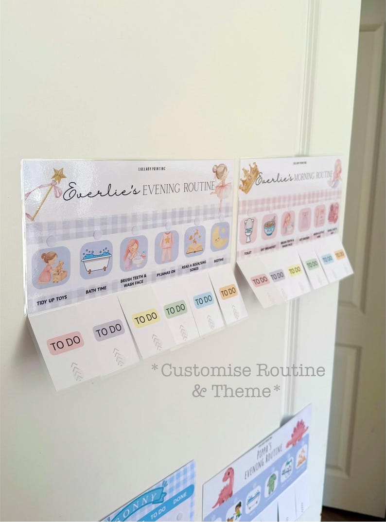 May include: Two rectangular routine charts with interactive flaps labeled Everlie's Evening Routine and Everlie's Morning Routine. Each chart features illustrated icons for daily tasks with corresponding flaps that display the text TO DO.