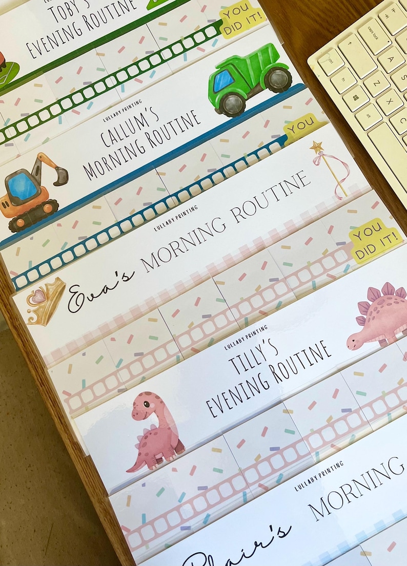 May include: A collection of personalized routine charts featuring colorful illustrations of construction vehicles, dinosaurs, and crowns. Each chart includes text such as Callum's Morning Routine, Eva's Morning Routine, and Tilly's Evening Routine.