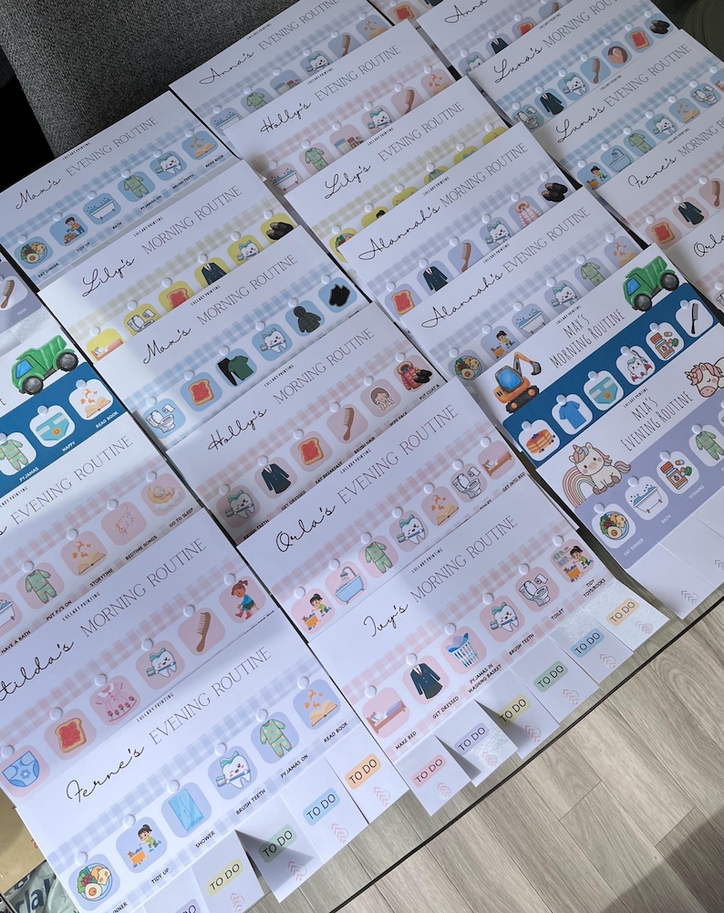 May include: A collection of personalized children's routine charts featuring various names like Anna, Max, and Mia. Each chart includes colorful icons for morning and evening tasks such as brushing teeth, getting dressed, and eating meals, with interactive tabs labeled to do.