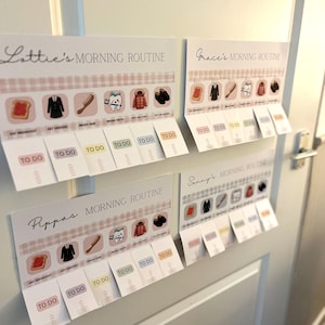 May include: Four white rectangular morning routine charts with pink gingham borders. Each chart features icons for breakfast, dressing, hair, teeth, coat, and shoes, with interactive flaps labeled TO DO below each task for Lottie, Grace, Pippa, and Sonny.