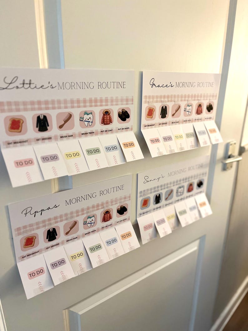 May include: Four white rectangular morning routine charts with pink gingham borders. Each chart features icons for breakfast, dressing, hair, teeth, coat, and shoes, with interactive flaps labeled TO DO below each task for Lottie, Grace, Pippa, and Sonny.