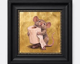 May include: A framed painting of a brown mouse holding a roll of white toilet paper. The mouse is positioned against a textured gold leaf background. The artwork is enclosed in a thick black frame with a decorative beaded inner border detail.