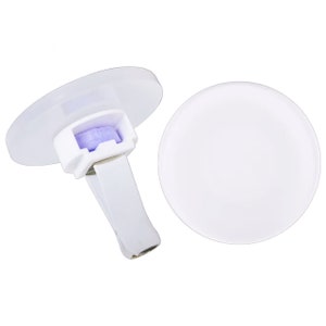 May include: White car air freshener with a purple scent disc and a clip to attach to a vent.
