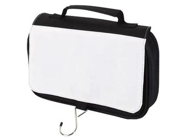 May include: Black and white hanging travel bag with a handle and a metal hook. The bag has a large white panel on the front, perfect for customization. The bag is designed for toiletries and travel.