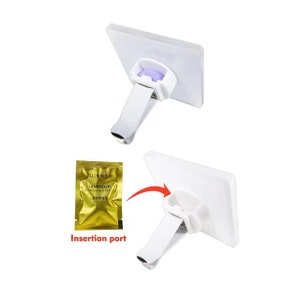 May include: White car air freshener with a clip on the back and a slot on the front for inserting a scented refill. The refill is a gold foil packet with the text "LAVENDER AIR FRESHENER" in English and Chinese.