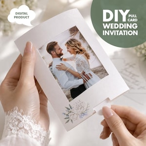 May include: A white DIY pull card wedding invitation featuring a photograph of a couple. The invitation has a floral design and the words "DIGITAL PRODUCT" in a speech bubble. The pull card is being held.