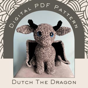 May include: A crocheted dragon plushie with speckled gray and black yarn, large blue eyes, and black horns and wings. The image includes the text "DIGITAL PDF PATTERN" and "Dutch The Dragon". The dragon is sitting on a gray surface.