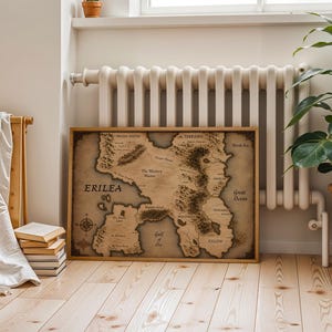 Vintage style fantasy map printable wall art of a mythical continent with detailed kingdoms and mountains. Aged parchment paper look, perfect for dark academia decor and book lovers room styling.