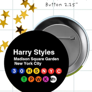 May include: A black 2.25-inch button featuring the text "Harry Styles" and "Madison Square Garden New York City." The button design includes colorful subway symbols. Gold star-shaped embellishments are scattered around the button.