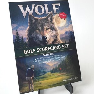 May include: A golf scorecard set titled "WOLF" featuring a detailed wolf illustration against a night sky backdrop. The set includes 10 scorecards, gameplay instructions, and an example scorecard. The image also shows a golfer on a green.