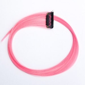 Pastel light pink hair extension clip in