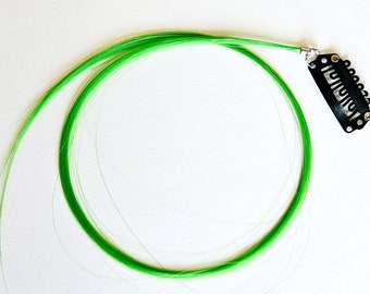 Green hair extension clip in, thin strand