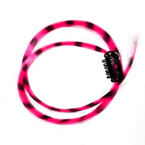 Pink feather hair extension clip in