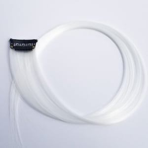 White hair extension clip in