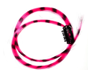 Pink feather hair extension clip in