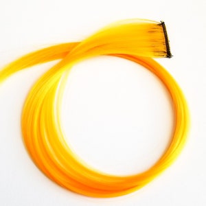 Hot neon yellow orange gold hair extension clip in