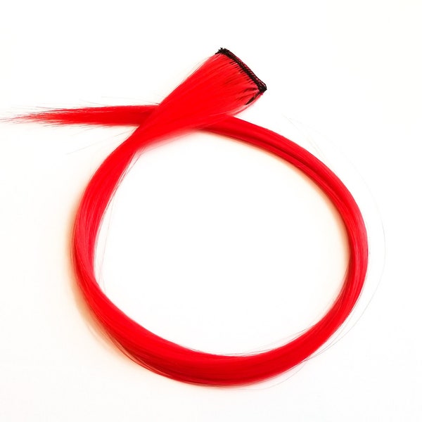 Red hair extension clip in