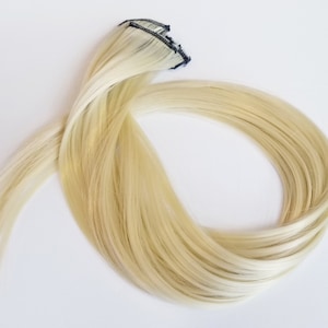 Blonde hair extension clip in