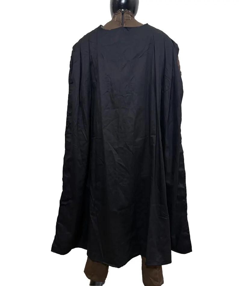 May include: A black cape with a long, flowing design. The cape is draped over a mannequin, showcasing its full length and shape. The fabric appears to be a smooth, matte material.
