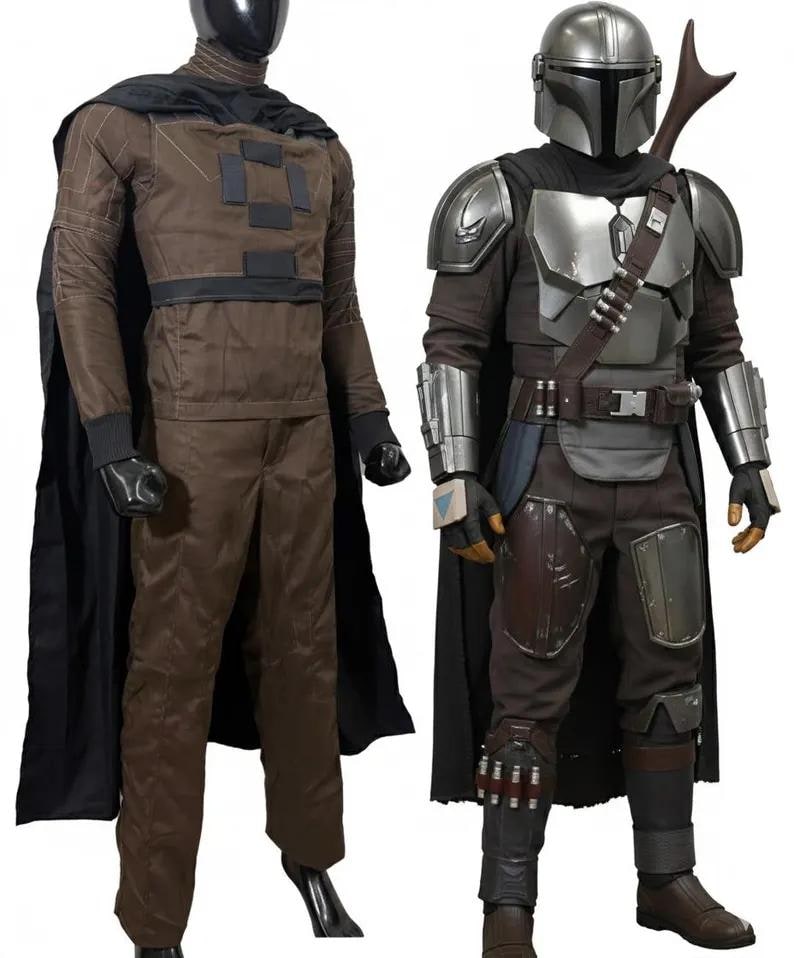 May include: Two full-body costumes on display. One is brown with a black cape, the other is a silver and brown Mandalorian costume with a helmet, armor, and a cape. Both costumes are displayed on mannequins against a white background.