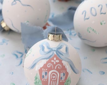 Hand-painted gingerbread house ornament with blue bow and candy, personalization available, baby boy's first Christmas