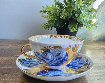Tazza e piattino in porcellana imperiale Lomonosov, URSS, vintage, con uccellino dorato da giardino.