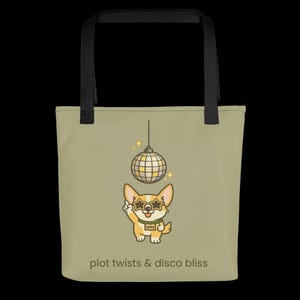 May include: A light green tote bag with black handles. It features a cartoon corgi wearing star-shaped sunglasses and a disco ball. The text "plot twists & disco bliss" is printed at the bottom.